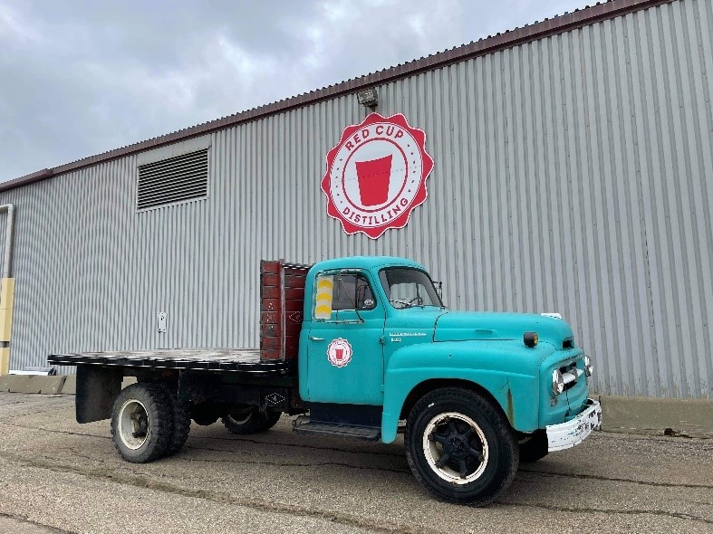 Red Cup Distillery with Company Truck in front